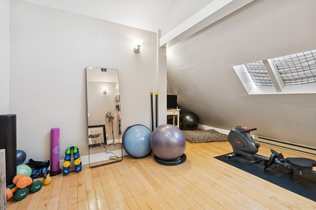 314 9th Ave W, Kalispell, MT 59901 - workout room with lofted ceiling, wood finished floors, and a baseboard radiator
