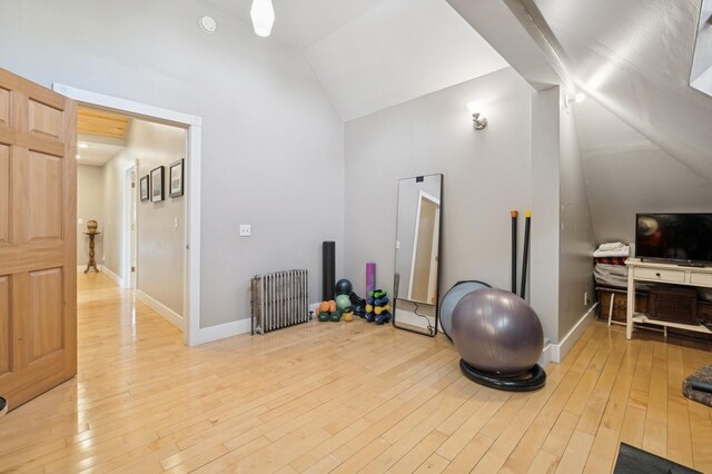 314 9th Ave W, Kalispell, MT 59901 - exercise area with vaulted ceiling, radiator, and light wood-style flooring