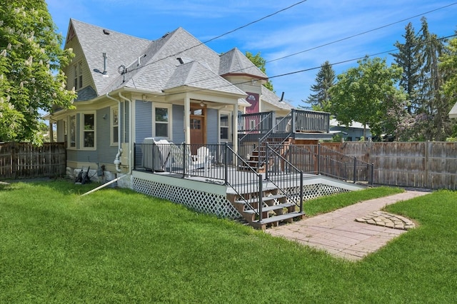 314 9th Ave W, Kalispell, MT 59901 - view of front of house featuring roof with shingles and a wooden deck