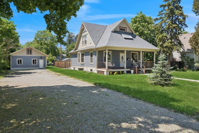 314 9th Ave W, Kalispell, MT 59901 - view of front of property featuring covered porch, a shingled roof, and a front lawn