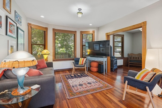 314 9th Ave W, Kalispell, MT 59901 - living area with radiator, wood finished floors, and recessed lighting