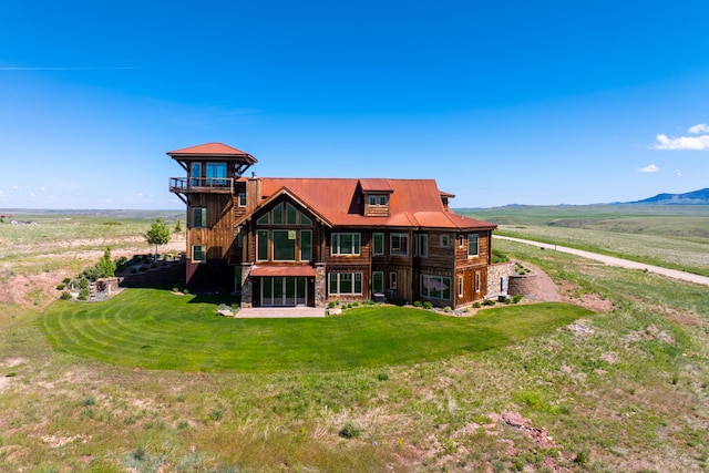 99 Little Belt Way, Belt, MT 59412 - rear view of house featuring a yard, stone siding, and a mountain view