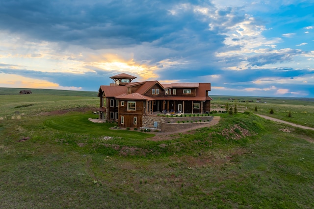 99 Little Belt Way, Belt, MT 59412 - rear view of house featuring a rural view, a yard, a balcony, and metal roof