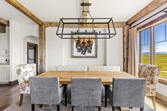 99 Little Belt Way, Belt, MT 59412 - dining area featuring dark wood-style floors and arched walkways