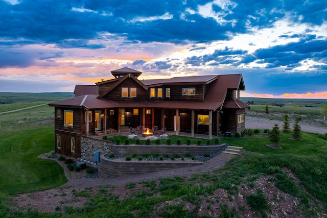 99 Little Belt Way, Belt, MT 59412 - back of house at dusk with a patio area