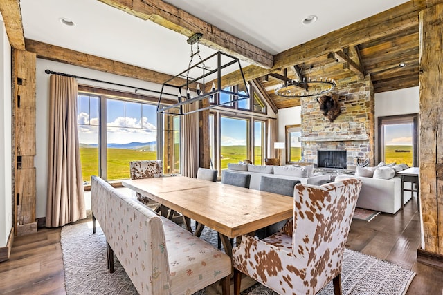 99 Little Belt Way, Belt, MT 59412 - dining area featuring a chandelier, hardwood / wood-style flooring, and a stone fireplace