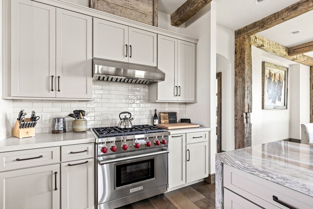 99 Little Belt Way, Belt, MT 59412 - kitchen featuring under cabinet range hood, luxury range, beamed ceiling, light countertops, and decorative backsplash