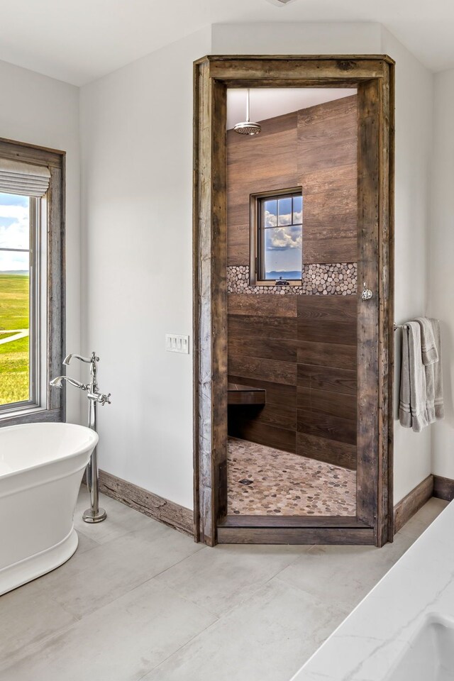 99 Little Belt Way, Belt, MT 59412 - bathroom with a shower stall, a freestanding bath, and baseboards