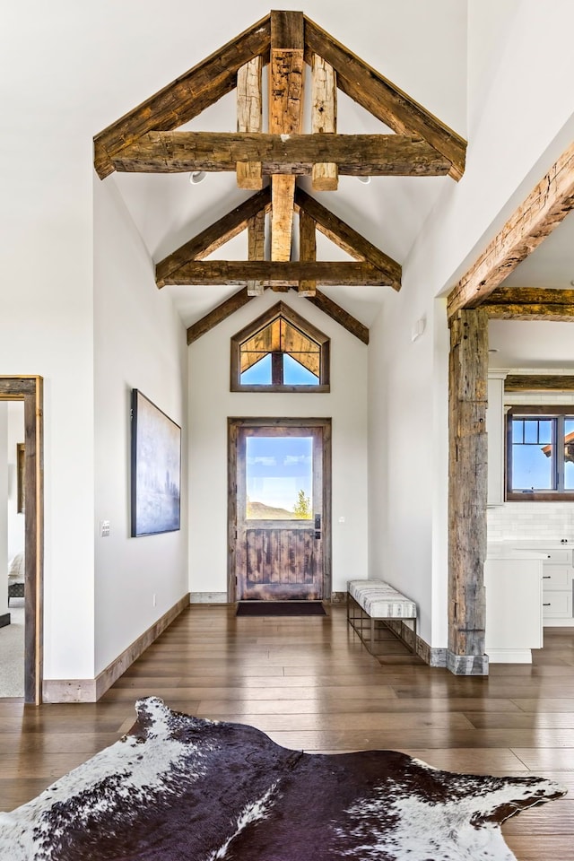99 Little Belt Way, Belt, MT 59412 - entryway featuring wood-type flooring, high vaulted ceiling, beam ceiling, and baseboards