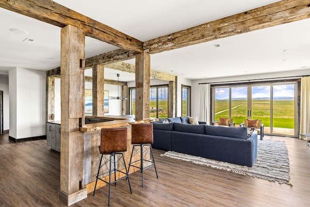 99 Little Belt Way, Belt, MT 59412 - living area featuring dark wood finished floors and beam ceiling
