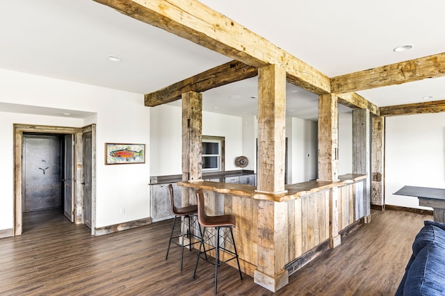 99 Little Belt Way, Belt, MT 59412 - kitchen with baseboards, dark wood-style flooring, recessed lighting, beamed ceiling, and a breakfast bar