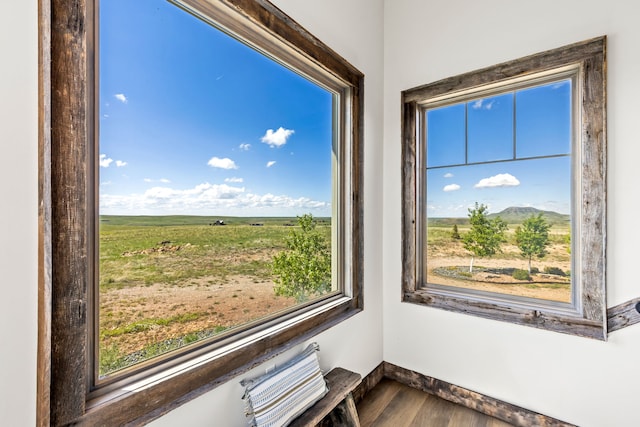 99 Little Belt Way, Belt, MT 59412 - detailed view of wood finished floors, baseboards, and a view of rural / pastoral area