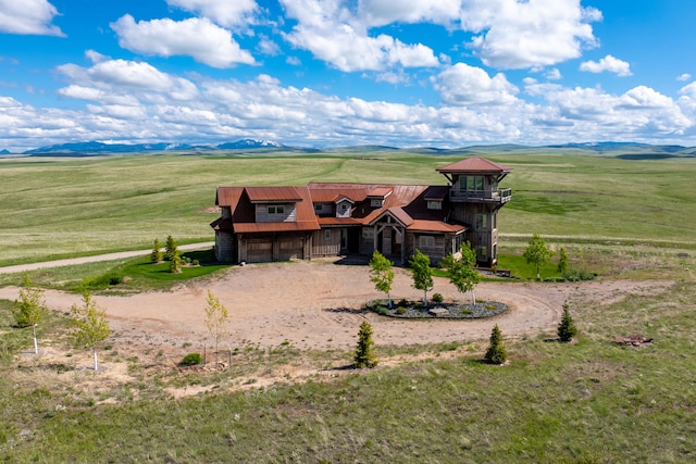 99 Little Belt Way, Belt, MT 59412 - view of front of home featuring curved driveway, a view of rural / pastoral area, a garage, and metal roof