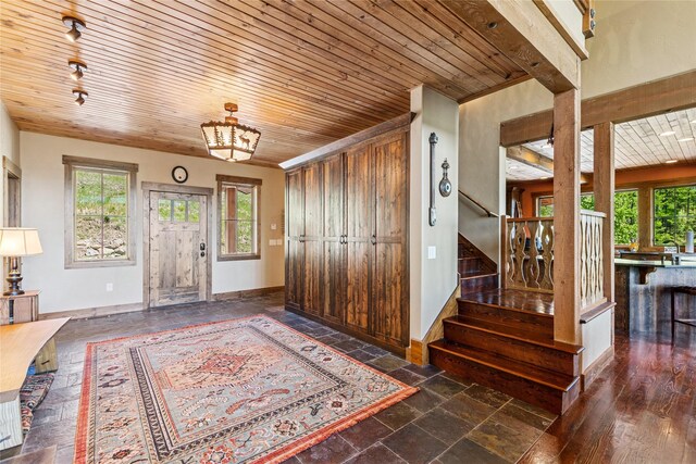 317 Elk Highlands Dr, Whitefish, MT 59937 - entrance foyer with plenty of natural light, wood ceiling, stairs, and baseboards