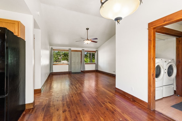 370 Prospector Trl, Bozeman, MT 59718 - unfurnished living room featuring washing machine and clothes dryer, ceiling fan, dark wood-style floors, vaulted ceiling, and baseboards