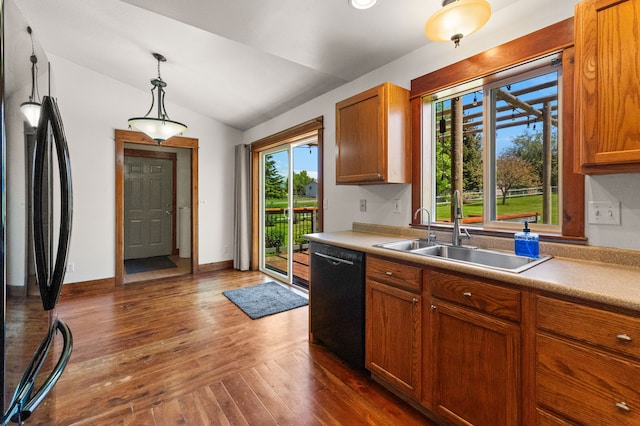 370 Prospector Trl, Bozeman, MT 59718 - kitchen with black appliances, a sink, lofted ceiling, dark wood finished floors, and brown cabinets