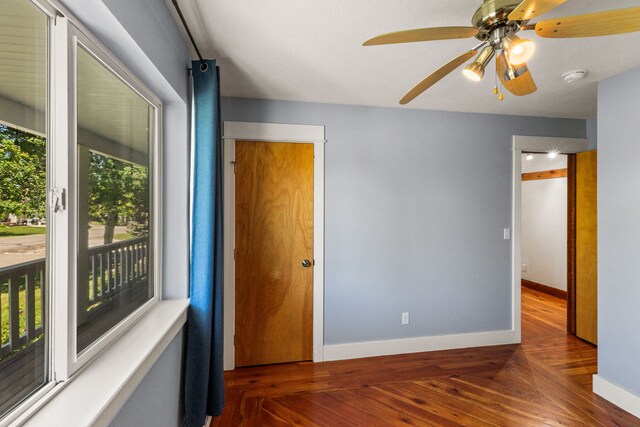 370 Prospector Trl, Bozeman, MT 59718 - unfurnished bedroom featuring wood-type flooring, baseboards, and ceiling fan