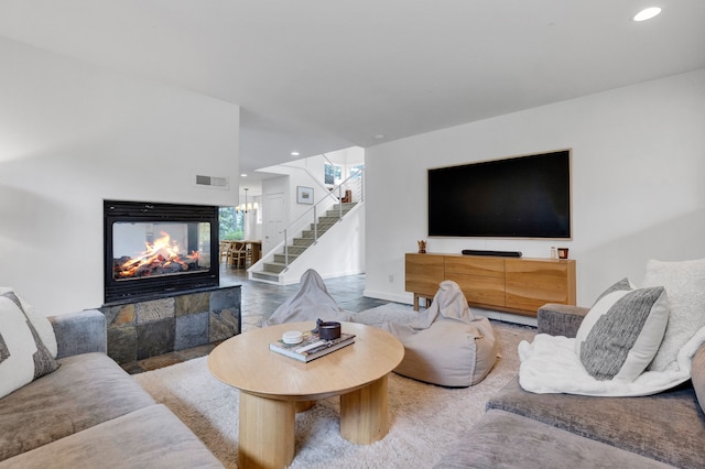 33535 Cherry Ln, Bigfork, MT 59911 - living area featuring stairway, a fireplace, and recessed lighting