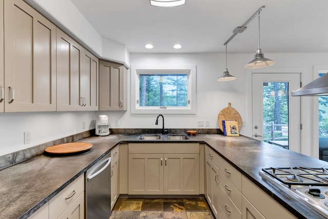 33535 Cherry Ln, Bigfork, MT 59911 - kitchen with appliances with stainless steel finishes, healthy amount of natural light, stone finish flooring, hanging light fixtures, and recessed lighting