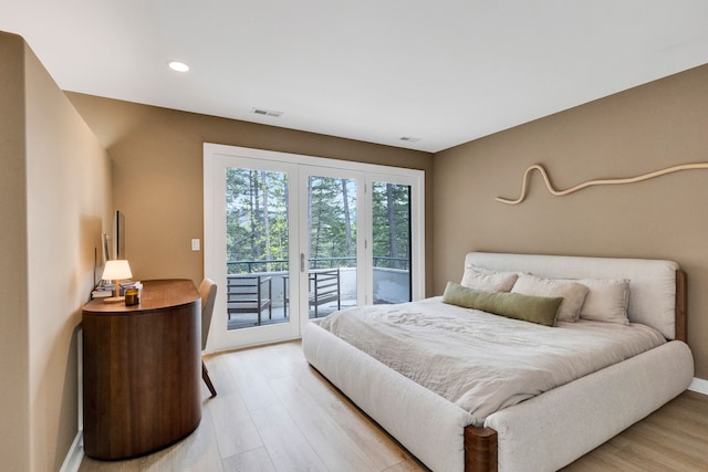 33535 Cherry Ln, Bigfork, MT 59911 - bedroom featuring access to exterior, light wood finished floors, baseboards, and recessed lighting