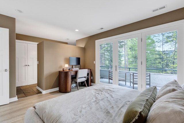 33535 Cherry Ln, Bigfork, MT 59911 - bedroom with access to outside, wood finished floors, baseboards, and recessed lighting