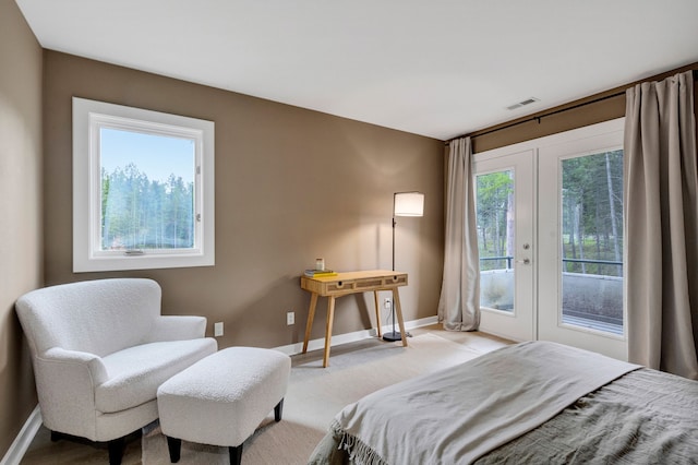 33535 Cherry Ln, Bigfork, MT 59911 - carpeted bedroom with french doors, access to exterior, and baseboards