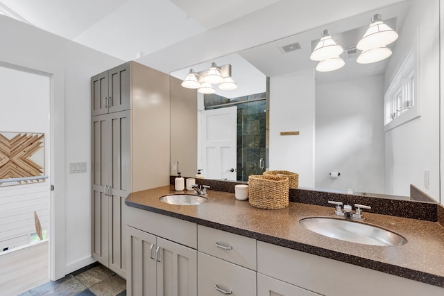33535 Cherry Ln, Bigfork, MT 59911 - bathroom featuring double vanity, a shower stall, and plenty of natural light