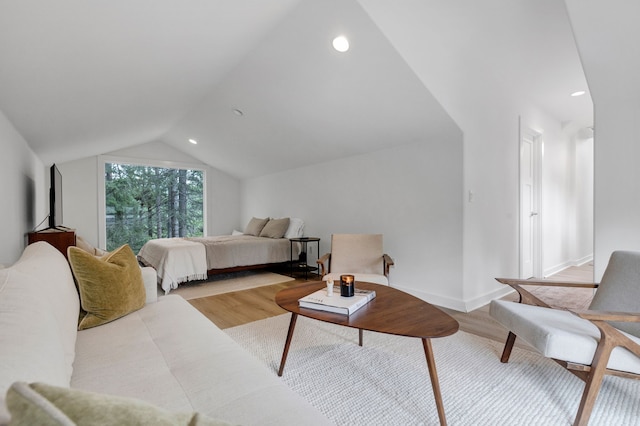 33535 Cherry Ln, Bigfork, MT 59911 - bedroom featuring light wood-type flooring, vaulted ceiling, and recessed lighting
