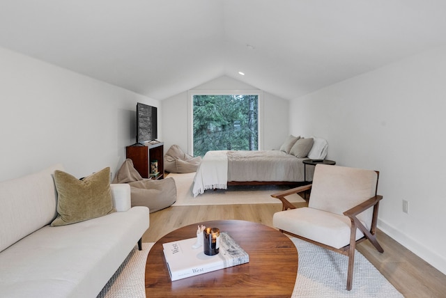 33535 Cherry Ln, Bigfork, MT 59911 - bedroom with lofted ceiling and light wood finished floors