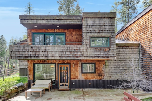 33535 Cherry Ln, Bigfork, MT 59911 - rear view of house featuring a patio area