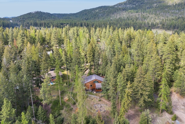 33535 Cherry Ln, Bigfork, MT 59911 - drone / aerial view of a heavily wooded area and a mountainous background