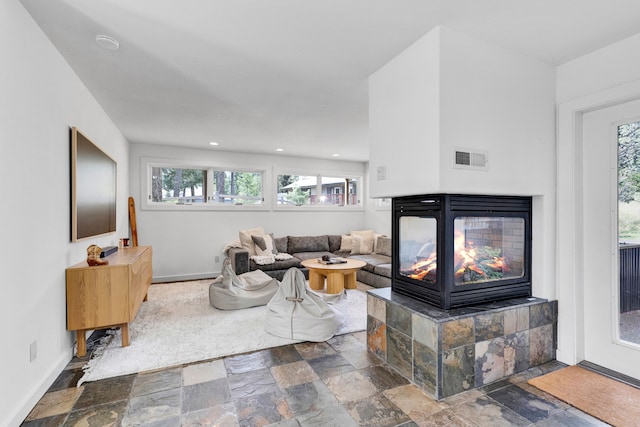 33535 Cherry Ln, Bigfork, MT 59911 - living area featuring stone tile flooring and recessed lighting