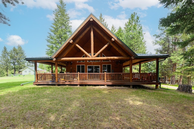288 Trout Dr, Rexford, MT 59930 - back of house with a lawn, a wooden deck, and a metal roof