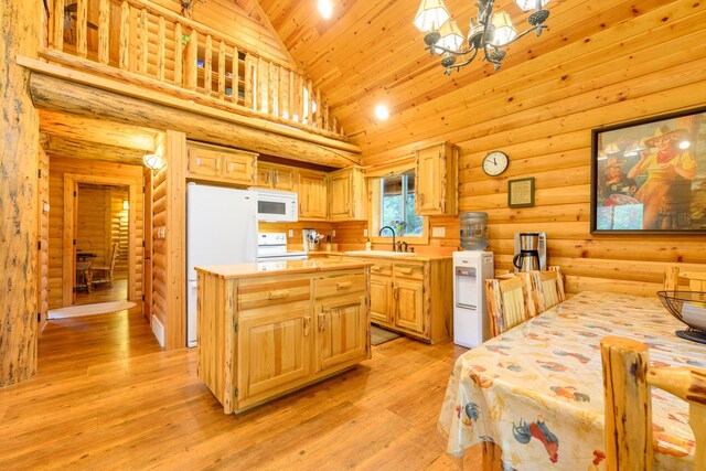 288 Trout Dr, Rexford, MT 59930 - kitchen featuring white appliances, light countertops, light brown cabinets, light wood-type flooring, and a chandelier