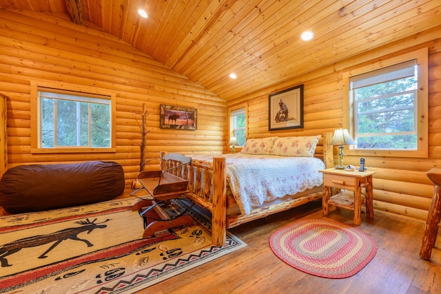 288 Trout Dr, Rexford, MT 59930 - bedroom with wood ceiling, log walls, multiple windows, hardwood / wood-style flooring, and recessed lighting