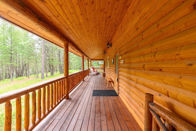 288 Trout Dr, Rexford, MT 59930 - wooden deck featuring a wooded view