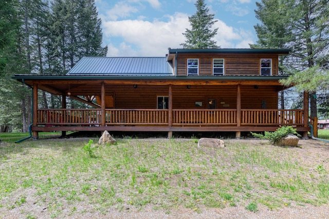 288 Trout Dr, Rexford, MT 59930 - view of front of property featuring log veneer siding, a metal roof, and a wooden deck