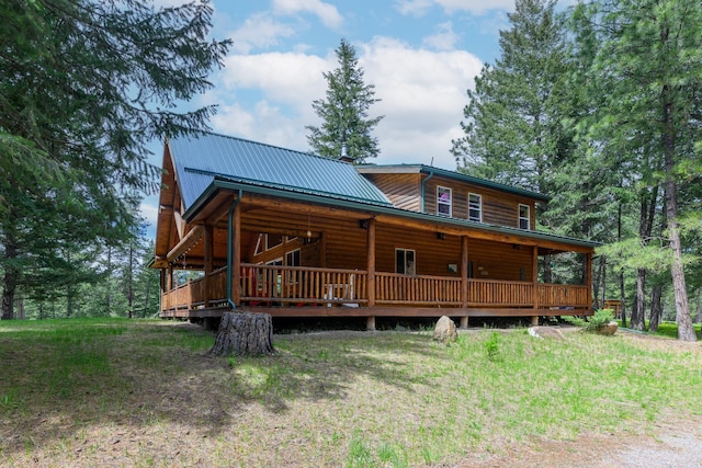 288 Trout Dr, Rexford, MT 59930 - back of property featuring a metal roof, faux log siding, and a deck