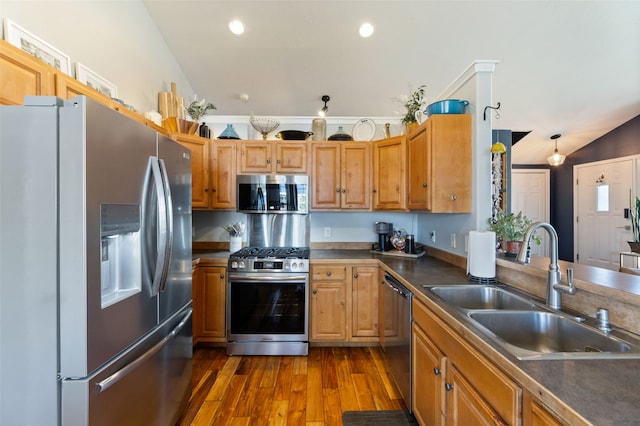 3197 Rose St, Bozeman, MT 59718 - kitchen with stainless steel appliances, a sink, dark countertops, dark wood-style flooring, and recessed lighting