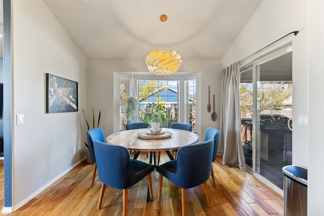 3197 Rose St, Bozeman, MT 59718 - dining area featuring lofted ceiling, light wood-style floors, and baseboards