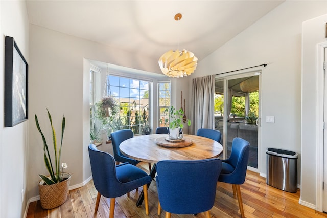 3197 Rose St, Bozeman, MT 59718 - dining area featuring light wood-style flooring, baseboards, and lofted ceiling