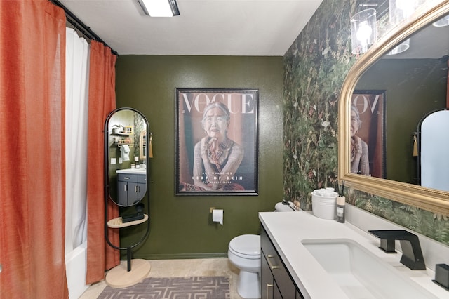 3197 Rose St, Bozeman, MT 59718 - bathroom with vanity, toilet, wallpapered walls, and shower / bath combo with shower curtain