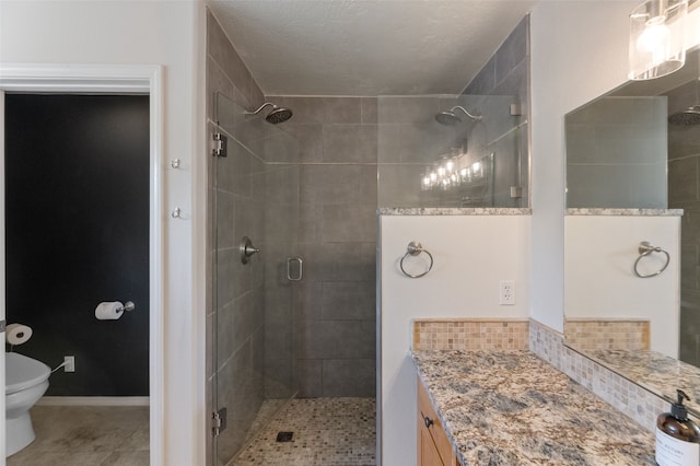 3197 Rose St, Bozeman, MT 59718 - bathroom featuring toilet, a shower stall, vanity, and tile patterned floors