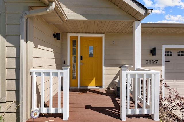 3197 Rose St, Bozeman, MT 59718 - view of exterior entry with a porch and a garage