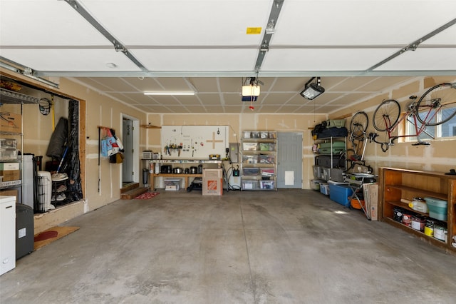 3197 Rose St, Bozeman, MT 59718 - garage with a garage door opener and a workshop area