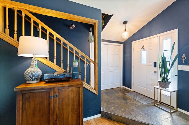 3197 Rose St, Bozeman, MT 59718 - foyer entrance with baseboards, stairs, and vaulted ceiling