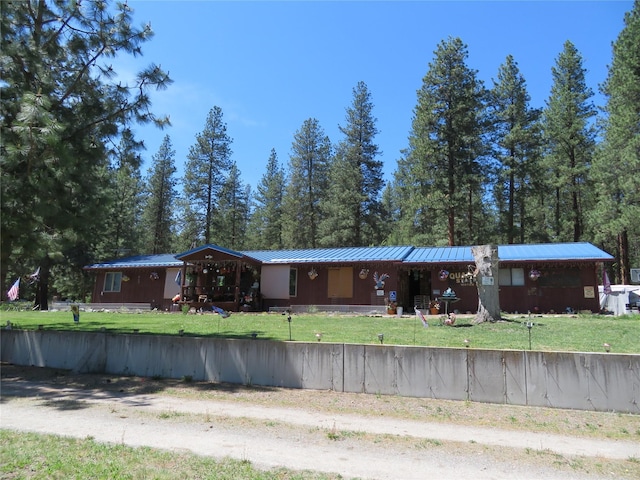 13567 Rosco Rd, Alberton, MT 59820 - view of front of home featuring metal roof and a front yard