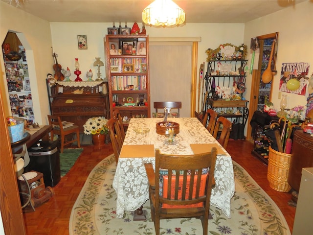 13567 Rosco Rd, Alberton, MT 59820 - dining room featuring arched walkways and a chandelier