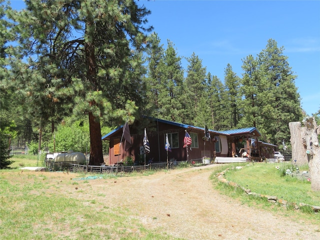 13567 Rosco Rd, Alberton, MT 59820 - view of front of home with metal roof and dirt driveway