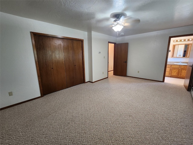 127 Patricia Way, Hamilton, MT 59840 - unfurnished bedroom with a closet, light carpet, ensuite bath, and ceiling fan